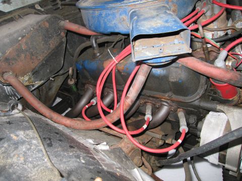 1991 Ford LTD Crown Victoria - Close-up view of an engine bay, showing the air cleaner and spark plug wires.