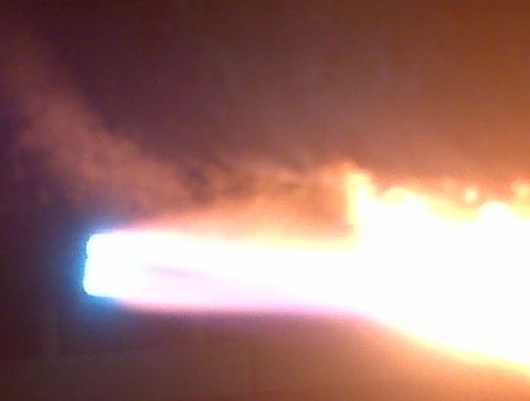 1996 Ford Bronco - Bright flames and smoke emanate from a jet engine exhaust.