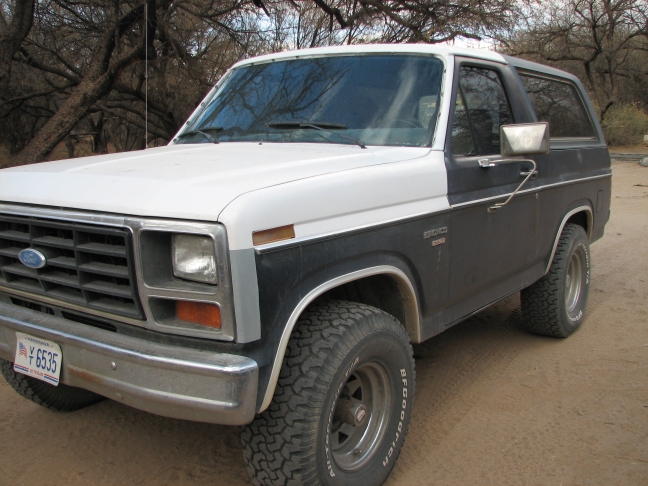 1982 Ford Bronco front quarter view, white and black two-tone paint, off-road tires