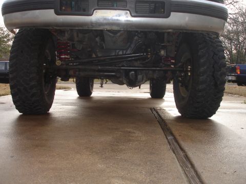 1996 Ford F-150 - Front view of a 1996 Ford F-150 showing its lifted suspension and large off-road tires.