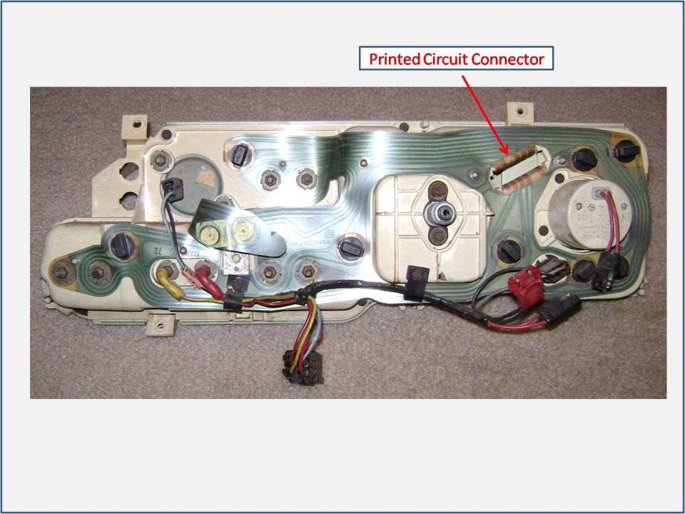 Back of an instrument cluster with printed circuit connector labeled
