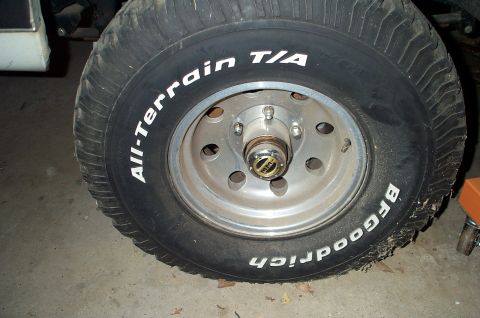 1996 Ford Bronco - A close-up view of a BFGoodrich All-Terrain T/A tire mounted on a vehicle's wheel.