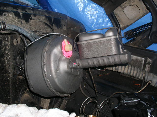 Brake booster and master cylinder mounted in engine compartment