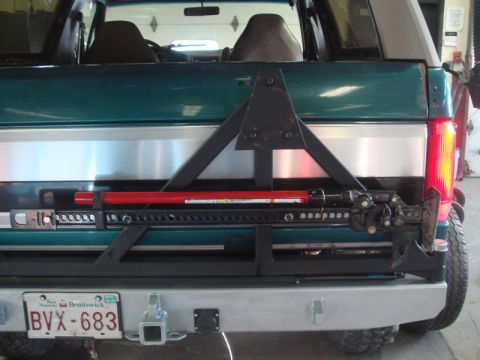 1991 Ford Bronco - This Ford Bronco features an aftermarket rear bumper and a high-lift jack mounted on the spare tire carrier.
