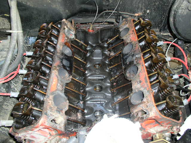 V8 engine with intake manifold removed showing lifter valley, pushrods and rockers