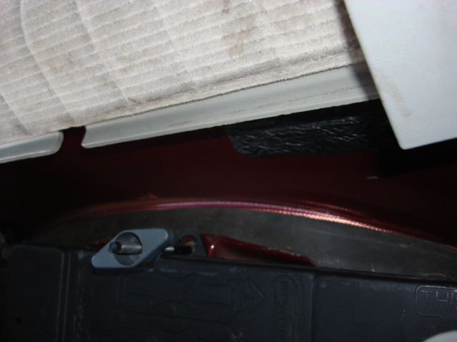 ok--now to the drivers side rear door speaker. these were replaced but i did not know the quality so out the stockers come. here is inside the "Jack" storage compartment i laid the wires out of the way.