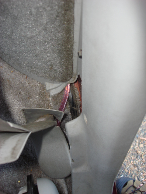1983 Ford Bronco - there was enough space to run it out under the panet without cutting it. i ran it under the trim panels.