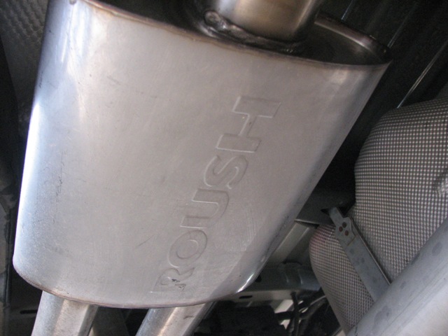 Close-up of a Roush exhaust muffler with visible branding