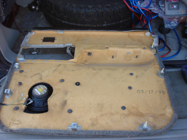 here is the whole door panel a few of the metal support mounts were torn from the door. you can see them missing they were still stuck to the door.