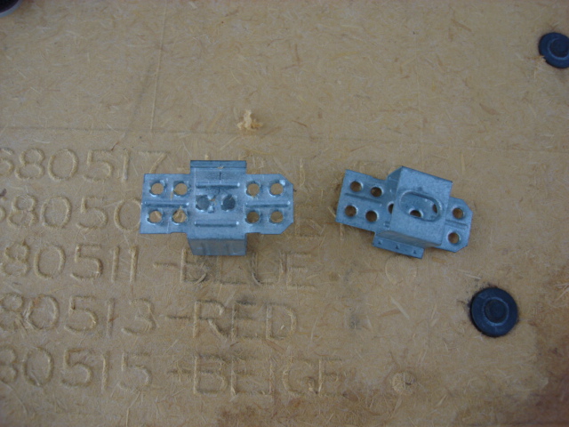 here are the brackets. i removed the old glue and door liner. reinstalling is easy line them up where they should be and hot glue them in place.