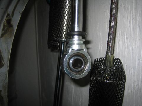 1987 Suzuki Samurai - Detail of an automotive linkage component, likely part of a steering or suspension system.