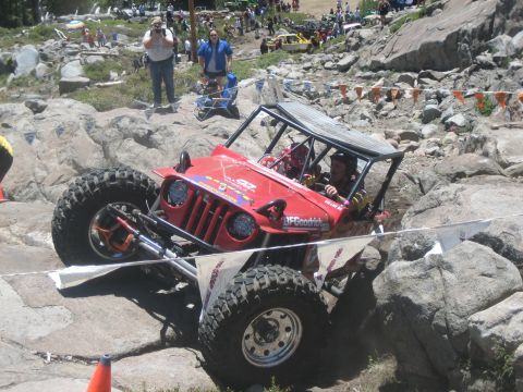 1995 Ford Bronco - This custom off-road buggy is tackling a challenging rock crawling course.