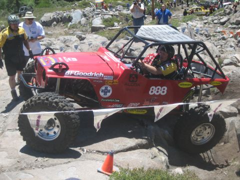 1995 Ford Bronco - Custom off-road buggy with roll cage and BFGoodrich tires on a rocky trail.