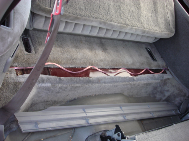 there is a trim panel that crosses the rear cargo area. i took the 5 screws out and pulled the cover.