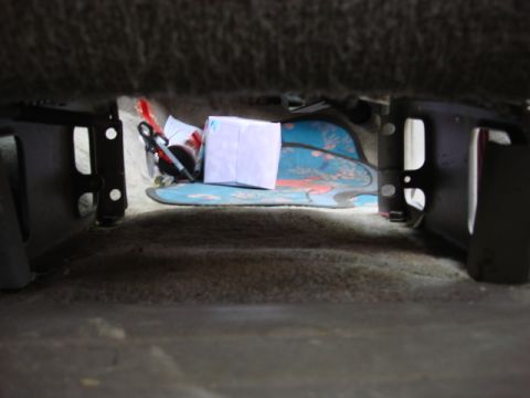 1983 Ford Bronco - here is the space below the pass seat. the sub amp and power block will work great here. out of sight and lots of air.