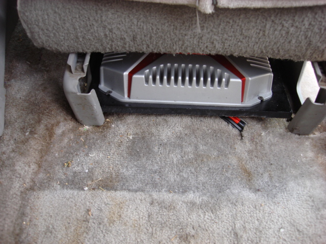 i made a small slot in the carpet for the wires. this is only seen with the seat all the way forward and tilted forward.