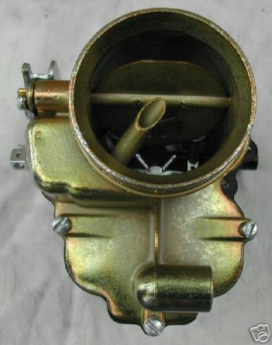 1953 Ford Mainline - A close-up view of a vehicle's carburetor, a critical engine component.