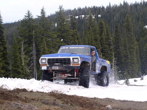 1979 Ford Bronco - This blue 1979 Ford Bronco navigates a snowy trail with a winch mounted on the front.