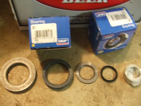 1996 Ford Bronco - Various automotive parts, including wheel bearings and seals, are displayed with their packaging.