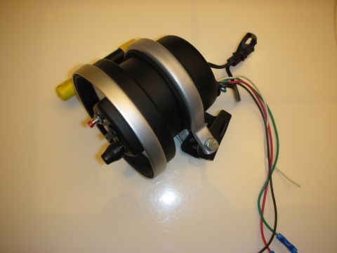1998 Ford Crown Victoria - Side view of an aftermarket pedestal-mount tachometer with silver bezel, yellow sun-shade and a colored wiring harness.