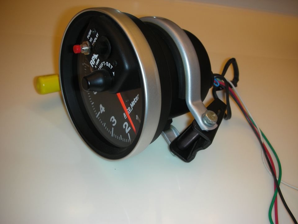 Aftermarket shift-light tachometer face showing RPM numbers