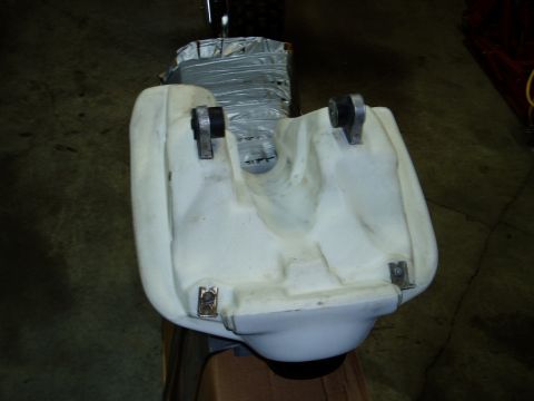 2000 Ford E350 - A white plastic fuel tank with metal mounting brackets is shown, with components wrapped in duct tape.