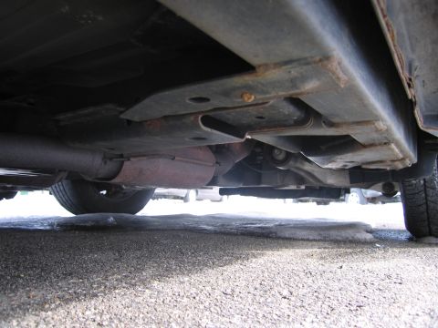 1991 Ford LTD Crown Victoria - Undercarriage of a vehicle, showing frame and exhaust system components.