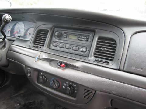 1991 Ford LTD Crown Victoria - Interior view of a car's dashboard, showing the radio, climate controls, and air vents.