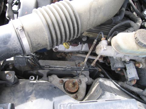 1991 Ford LTD Crown Victoria - Close-up view of an engine bay, showing various mechanical parts and hoses.