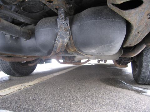 1991 Ford LTD Crown Victoria - Underside view of a vehicle, focusing on the fuel tank and associated components.