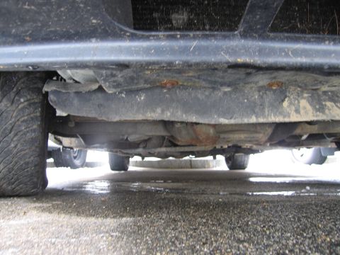 1991 Ford LTD Crown Victoria - Underside view of a car, revealing its frame and suspension system.