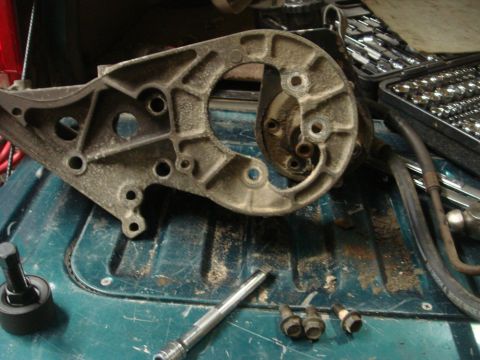 1996 Ford Bronco - Close-up of a disassembled power steering pump bracket and associated hardware.