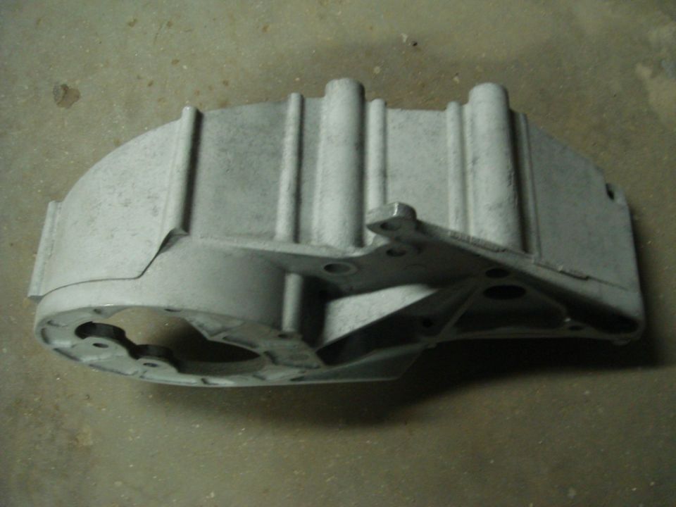 Aluminum casting part with mounting bracket and circular opening