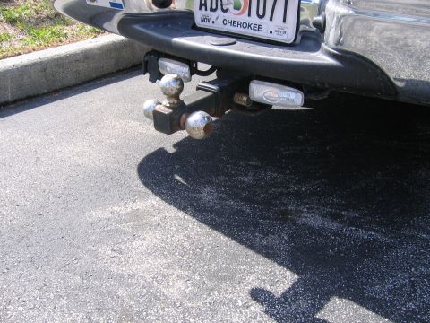 2001 Ford F-150 - Close-up of a trailer hitch assembly with dual balls and auxiliary lights.
