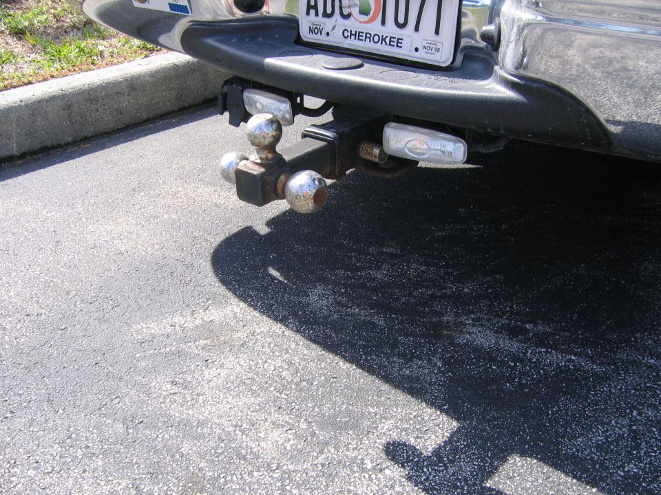 Trailer hitch with dual balls and lights mounted on a vehicle bumper