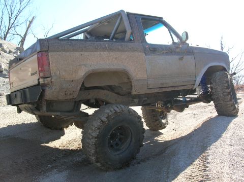 1985 Ford Bronco II - my passenger side rear shock hits the frame when almost completely compressed:/ so I need to move it.