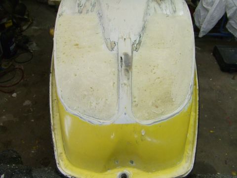 1998 Kawasaki JH1100-A4 1100 ZXi - Close-up of a yellow and white hull section undergoing restoration work.