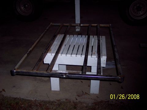 1984 Toyota 4Runner - A metal roof rack frame is shown resting on a white slatted bench.