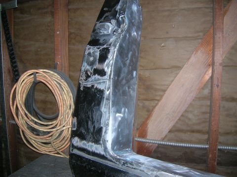 1985 Ford Bronco - rear of door filler plate ground down.