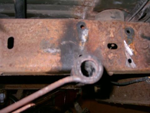 1994 Ford Bronco - Close-up of rusted vehicle frame and suspension components, likely from an older truck or SUV.