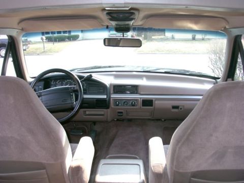 1994 Ford Bronco - Interior view of a 1994 Ford Bronco, showing the dashboard, steering wheel, and front seats.
