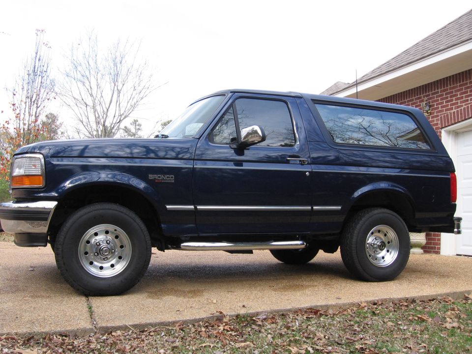 Dark blue Ford Bronco side view