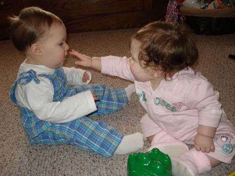 2000 Ford Crown Victoria - A tender moment captured as two young children explore their surroundings and each other.
