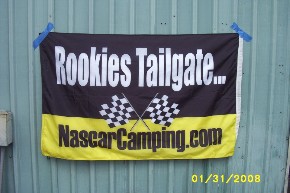 Banner with "Rookies Tailgate..." and "NascarCamping.com" text and checkered flags