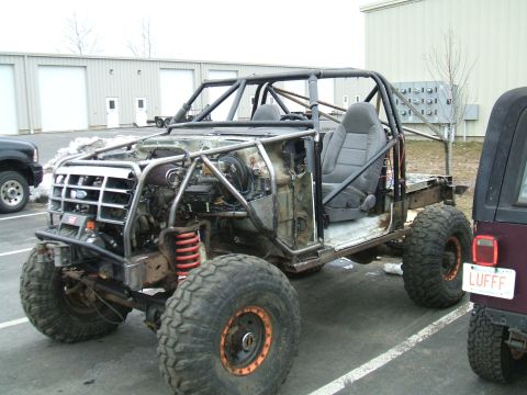 1995 Ford Bronco - This heavily modified 1995 Ford Bronco features a custom roll cage and is stripped down for off-road use.