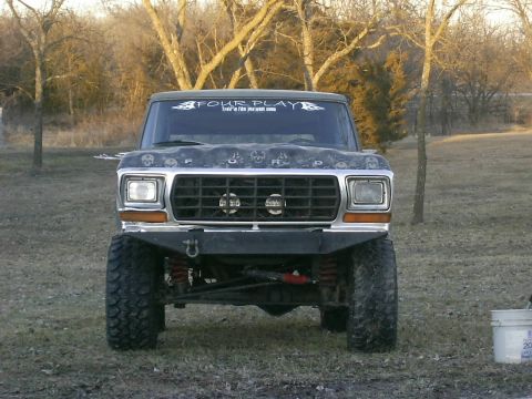 1978 Ford Bronco - This 1978 Ford Bronco features a lifted suspension, custom front bumper, and unique skull decals across the hood.
