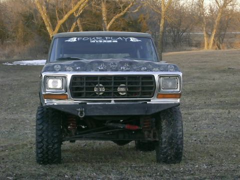 1978 Ford Bronco - Front view of a 1978 Ford Bronco with aftermarket bumper and hood graphics.