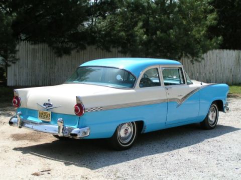 1956 Ford Fairlane - This two-tone sedan features chrome accents and a distinctive body style.
