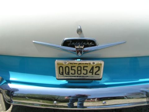 1956 Ford Fairlane - Rear view of a 1956 Ford Fairlane showing the Fairlane emblem and license plate.