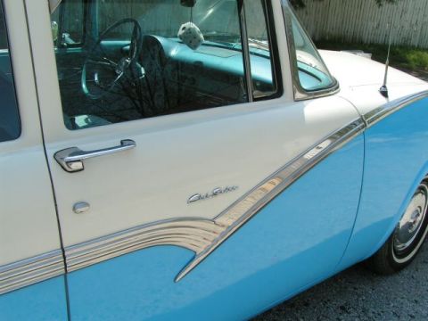 1956 Ford Fairlane - Side view of a 1956 Ford Fairlane, highlighting its two-tone paint and interior details.